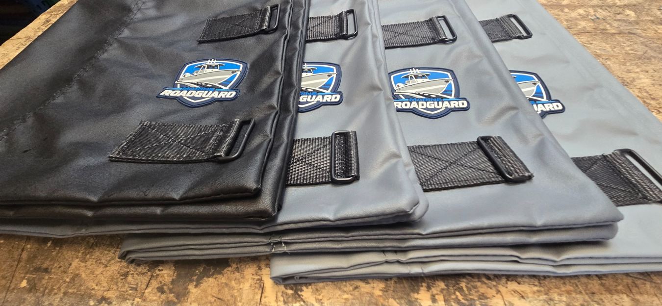 Finished Marine RoadGuard shields arranged on a worktable