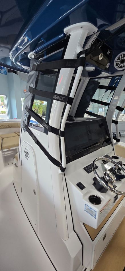 Marine RoadGuard windshield attachment system installed on a center console boat